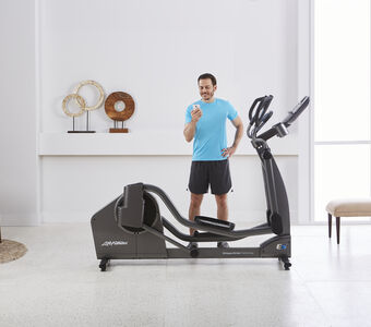 Lifestyle Male looking at phone E5 Cross Trainer 6754 mr